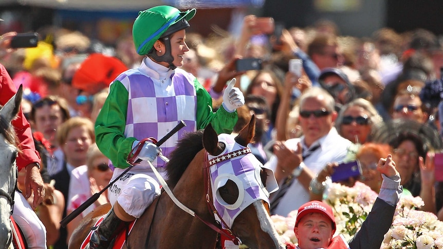 Michelle Payne celebrates aboard Prince Of Penzance