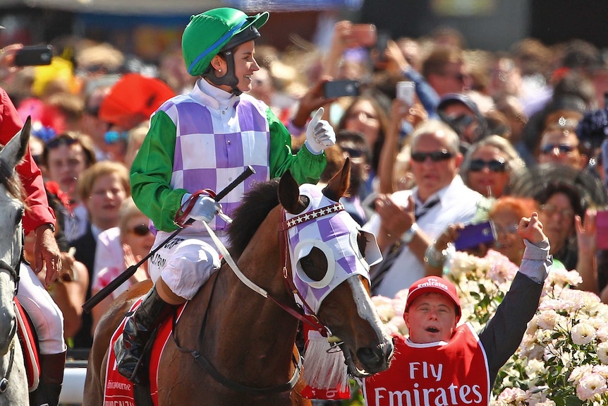 Michelle Payne celebrates aboard Prince Of Penzance