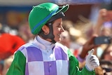 Michelle Payne celebrates aboard Prince Of Penzance