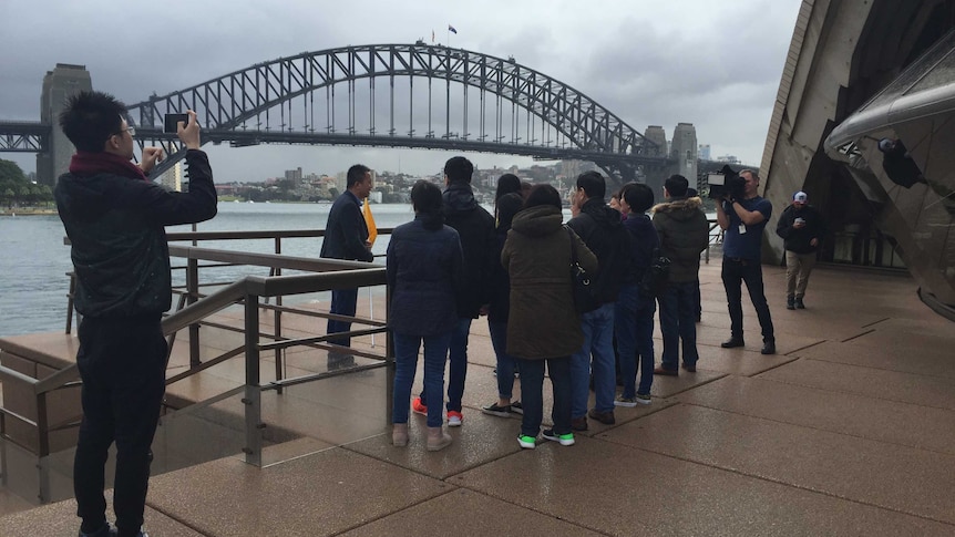 Chinese tourists by the Sydney Harbour Bridge
