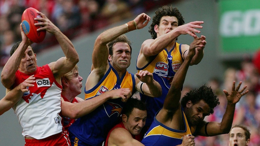 Grand final hero ... Leo Barry takes his crucial mark in the dying seconds of the 2005 decider