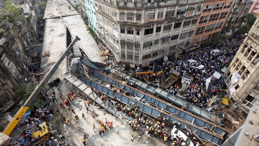 Rescue workers at scene of bridge collapse in India