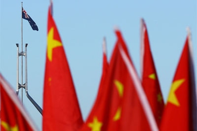 Chinese flags with Australian flag in the background