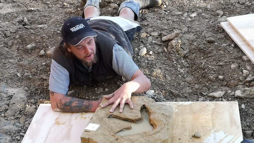 Michael Johnston with one of the extracted footprints