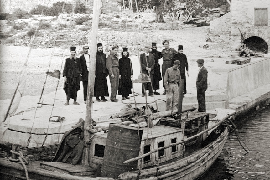 New Zealand soldiers pose with monks