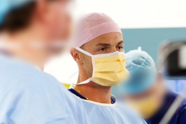 Dr William Braun wears a surgical mask.