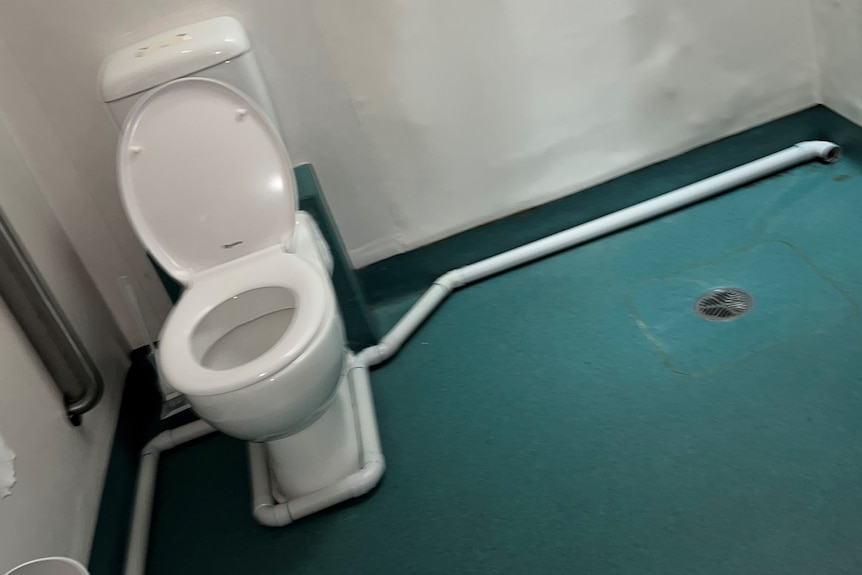 Poor plumbing around a toilet.