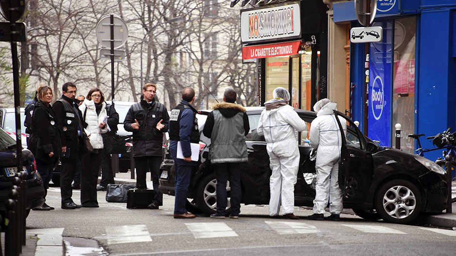 French police examine the attackers' abandoned getaway car. (Photo: AFP/Dominique Faget)