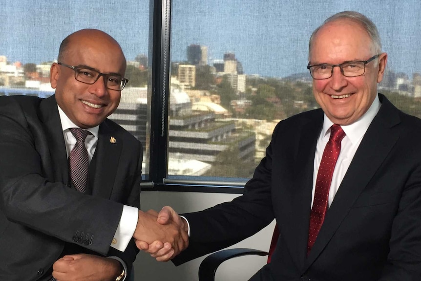 Sanjeev Gupta shakes hands with Ross Garnaut