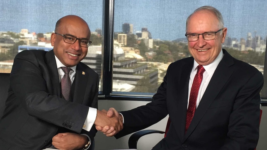 Sanjeev Gupta shakes hands with Ross Garnaut