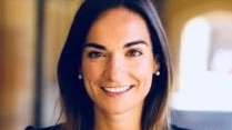 Dr Gorana Grgic, a woman with dark brown hair, smiles at the camera