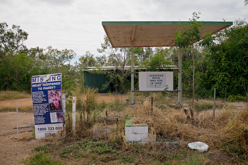 A picture of a missing sign with Paddy Moriarty's name and details next to a shed and overgrown weeds.