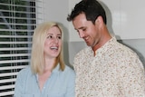 Rowan and Kate Lamason standing next to a kitchen bench containing a tuna roll