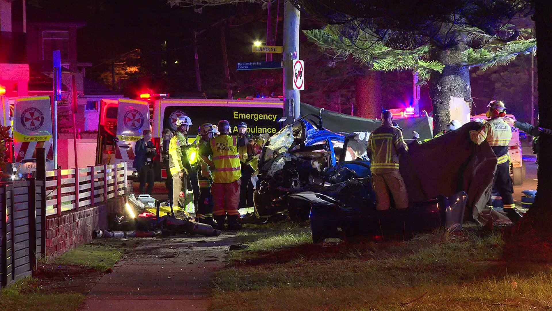emergency services at a crash scene where two young boys died