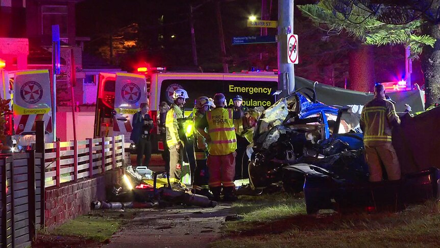emergency services at a crash scene where two young boys died