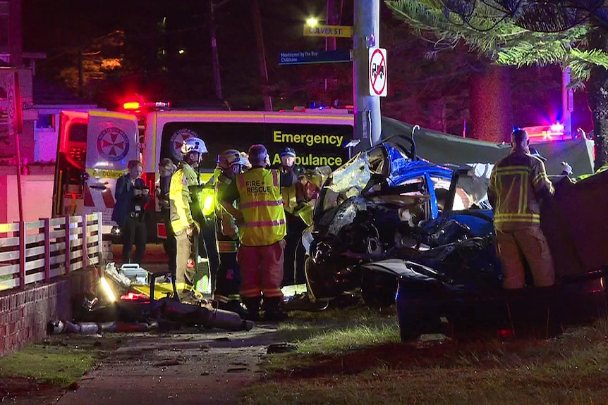 emergency services at a crash scene where two young boys died