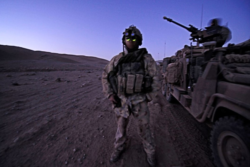 A soldier from 2nd Commando Regiment in the early morning light in Afghanistan.