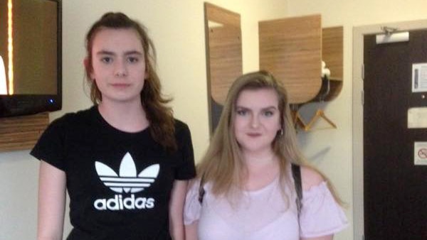 Laura MacIntyre and Eilidh MacLeod stand next to eachother and smile at the camera.