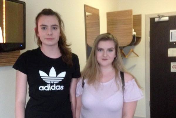 Laura MacIntyre and Eilidh MacLeod stand next to eachother and smile at the camera.