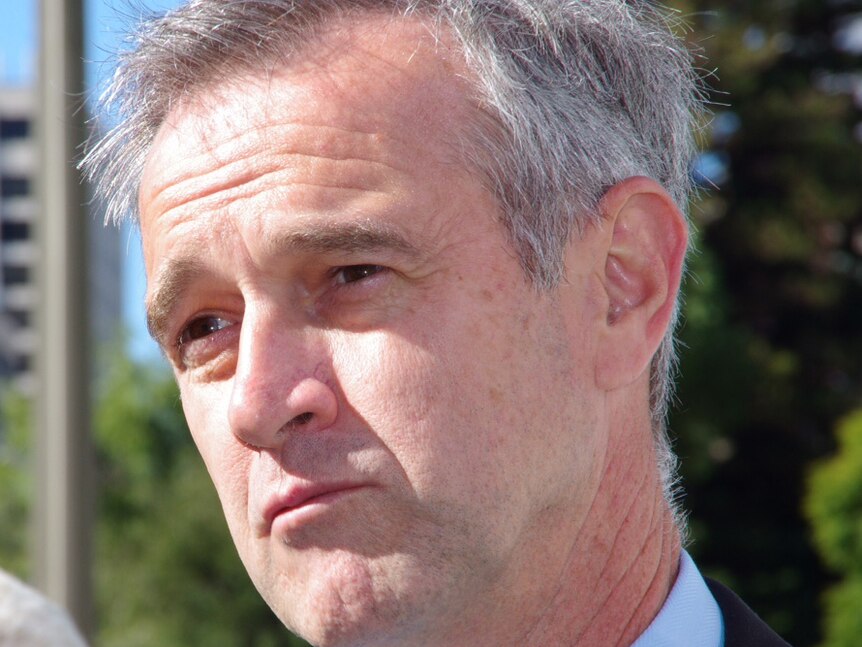 Close up of WA Local Government Minister Tony Simpson outside on a bright day