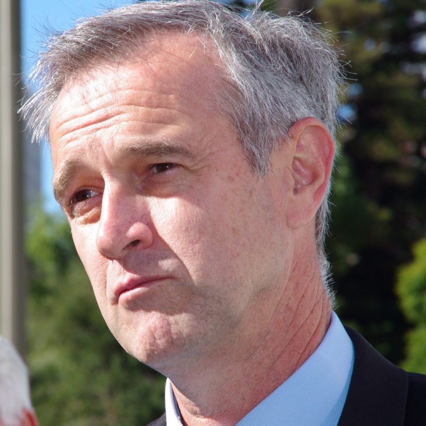 Close up of WA Local Government Minister Tony Simpson outside on a bright day