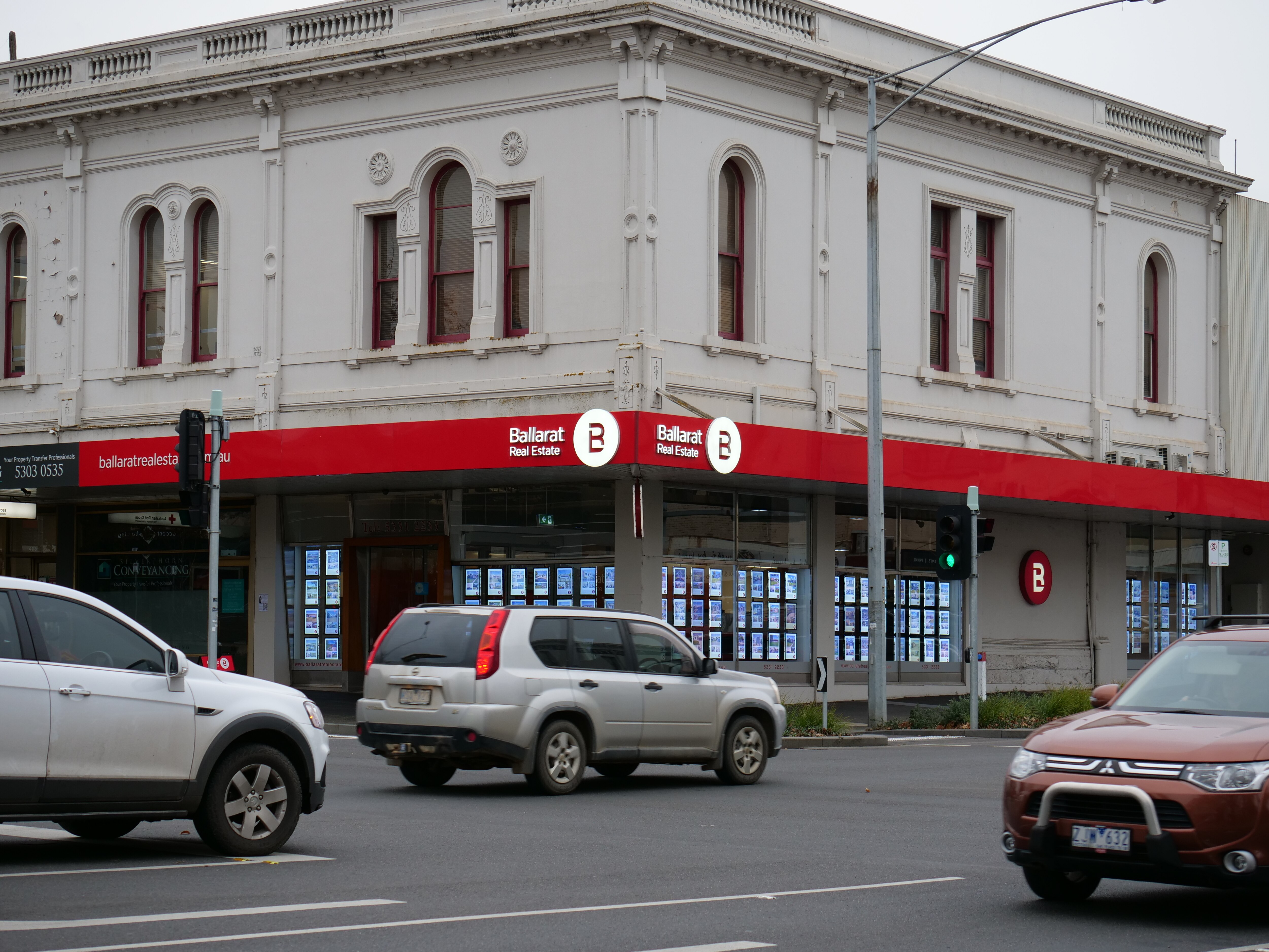 A real estate building on a street.