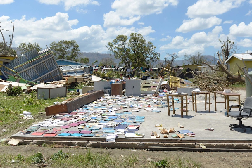 Books recovered from a school are left out to dry in Port Vila