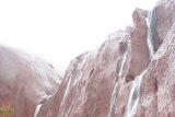 Water cascades down Kantju Gorge at Uluru