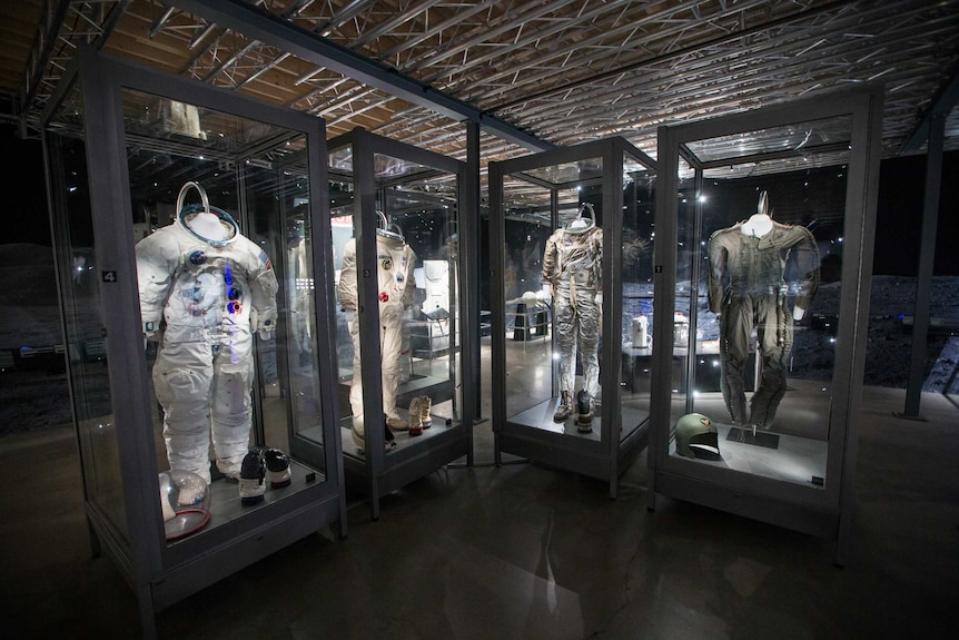 Space suits on display in Queensland Museum.