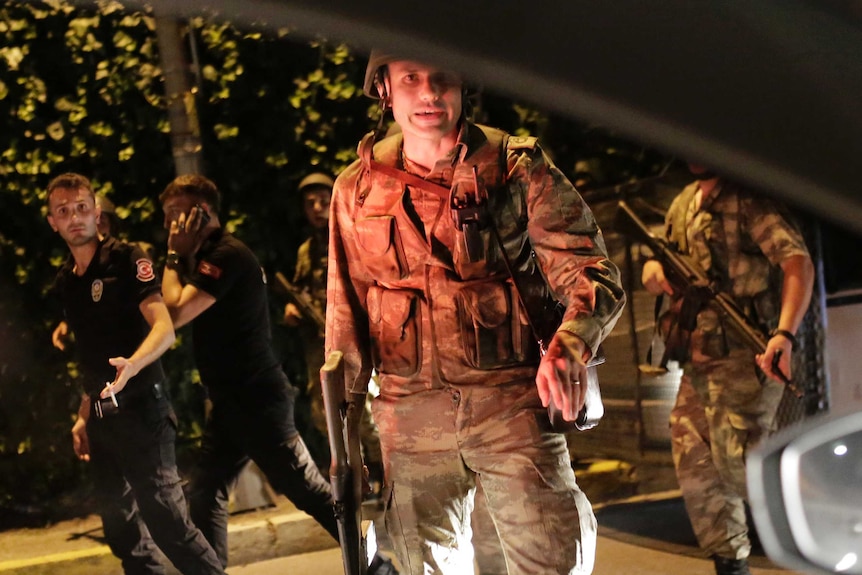 Turkish military personnel seen through a window of a car on the Bosphorus Bridge.