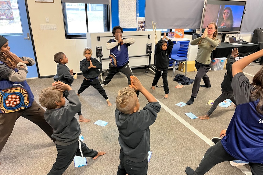 A group of students doing yoga.