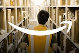 An Amazon worker in the warehouse with the Amazon logo arrow overlayed.