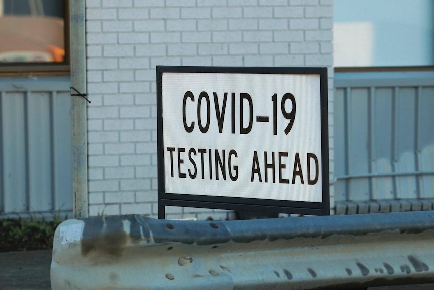 Sign reading COVID-19 testing ahead.