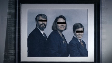 A man, woman, and child dressed up in suits for a family portrait, with black bars across their eyes