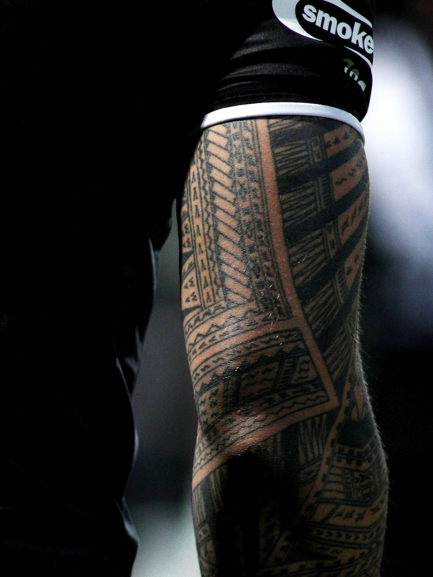 Close up of a tattooed arm.