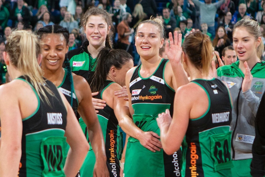 Fever players celebrate victory over the Vixens.