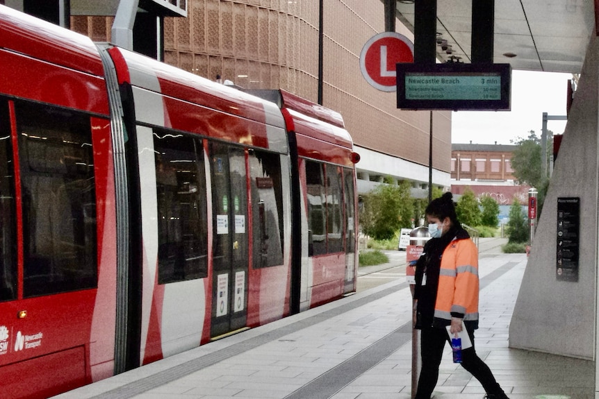 A cleaner at the Newcastle light rail.