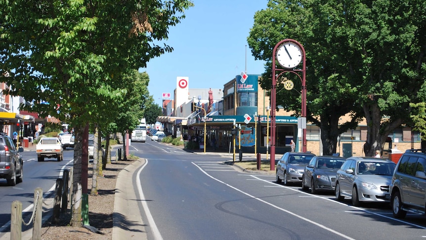 The main drag of a historic looking country town on a pristine day.