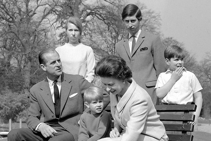 A black and white family portrait of the Queen, Prince Philip and their four children.