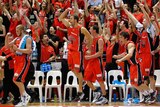 Top Cats: The Perth bench erupted after Kevin Lisch drained a buzzer-beating three-pointer.