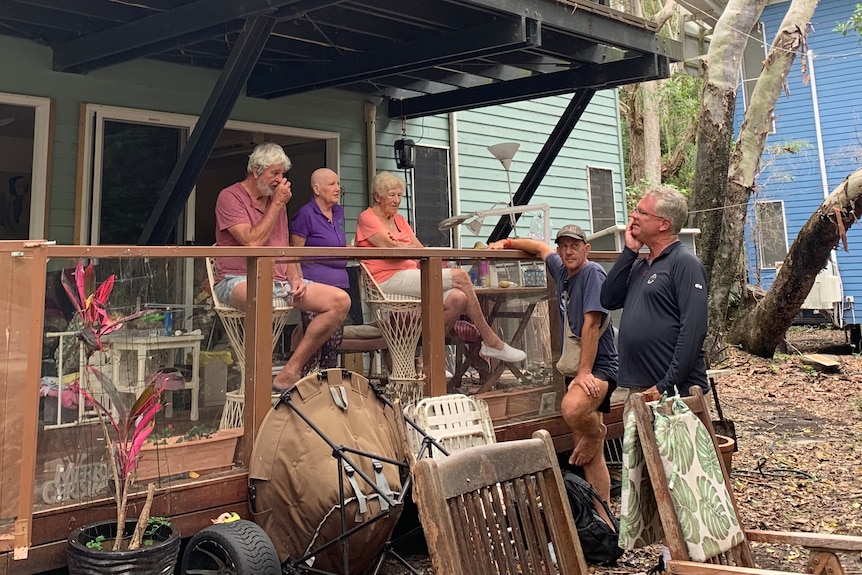 residents behind a house