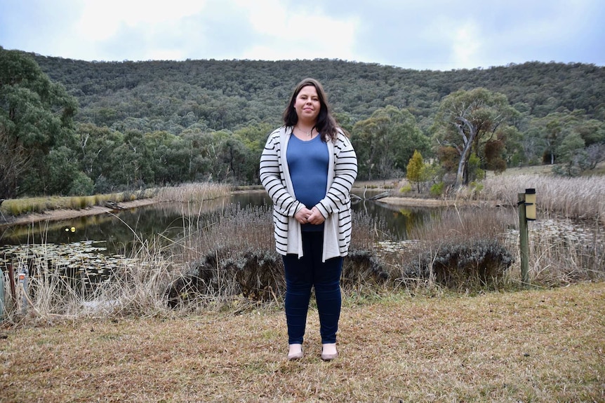 Portrait of Sarahjane Bradford who overcame experiences of domestic violence and is grateful to her elected parents for support.