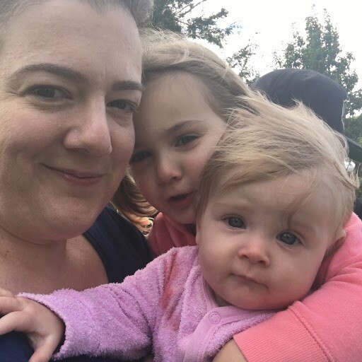 Selfie of a mother with her two young children to depict the cost of childbirth.