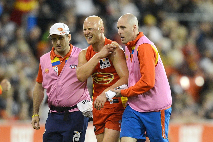 Suns captain Gary Ablett comes off the field in pain against Collingwood at Carrara in July 2014.
