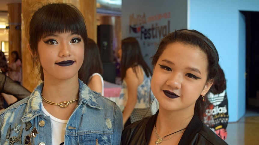 Indonesian 13-year-old Alice, who performed a K-pop routine, with a friend.