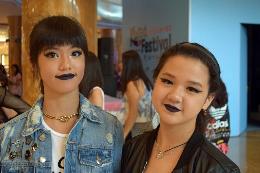 Indonesian 13-year-old Alice, who performed a K-pop routine, with a friend.