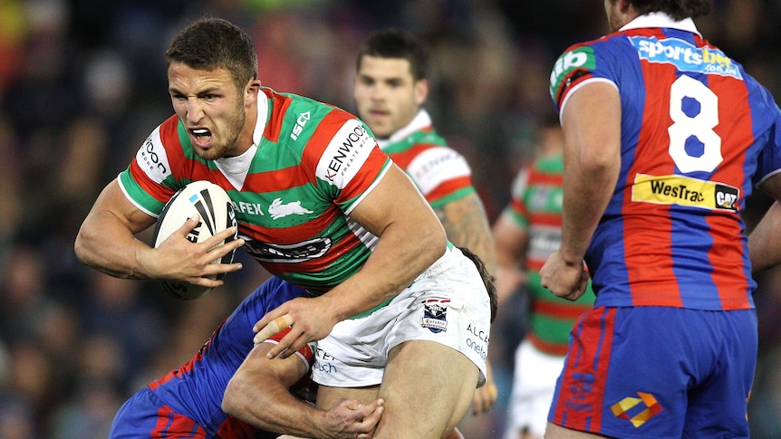 On the burst ... Sam Burgess tries to beat the Knights defence