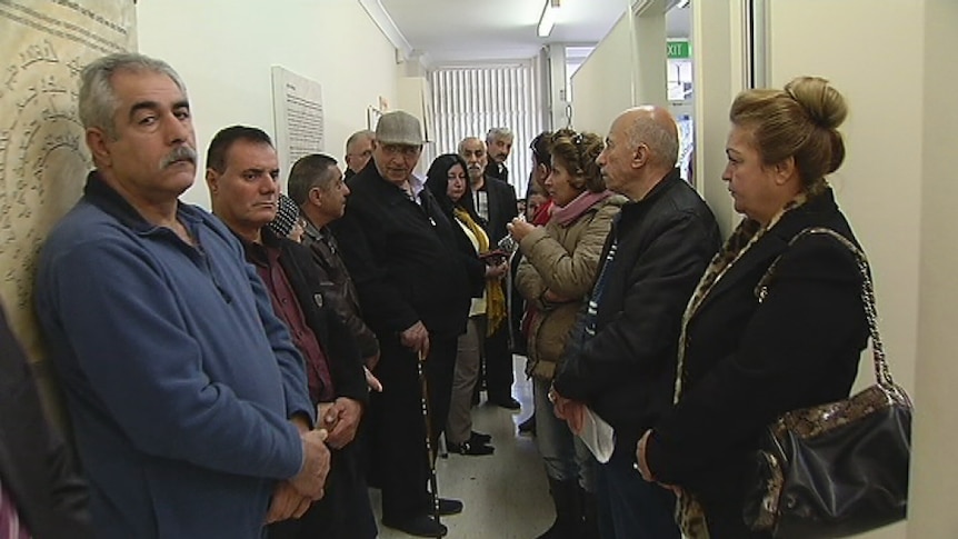 People wait to seek help with immigration applications at the Assyrian Resource Centre in Fairfield, western Sydney.