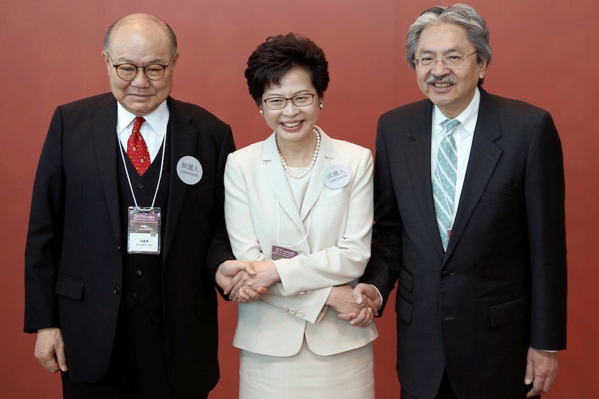 Candidates pose for a picture during the election for Hong Kong's next chief executive.