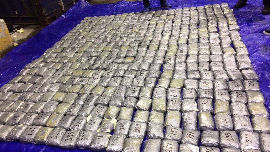 Bundles of wrapped drugs lying on floor